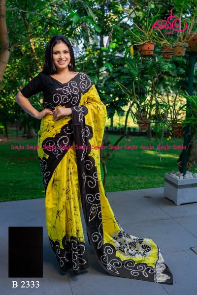 Yellow and Black colored Batik Saree B2333